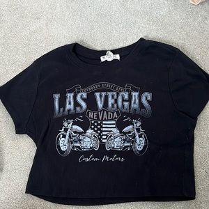 Cropped black top. New condition, never worn.